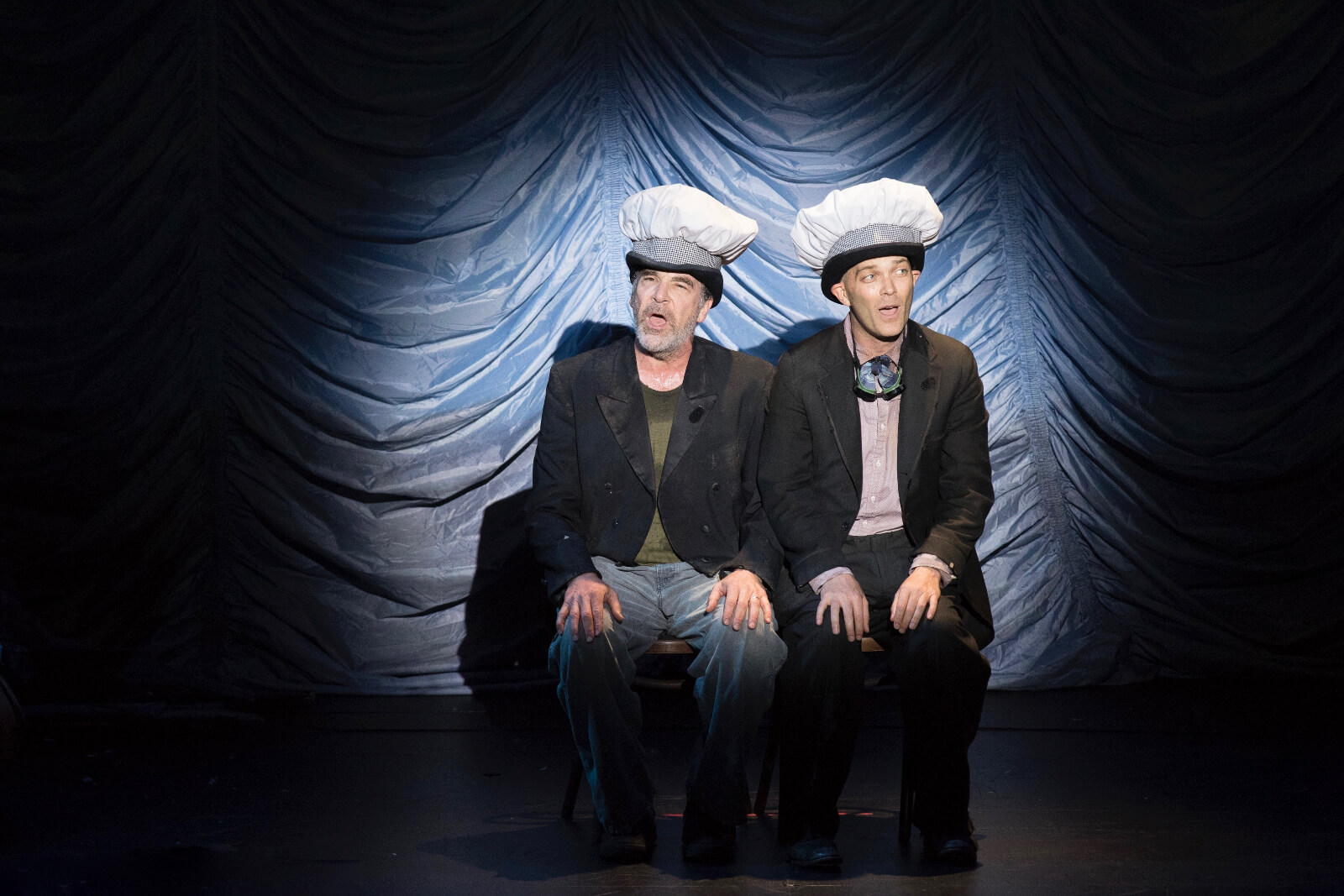 Mandy Patinkin and Taylor Mac singing "Making Pies". They are wearing bakers hats on top of their derby hats. 