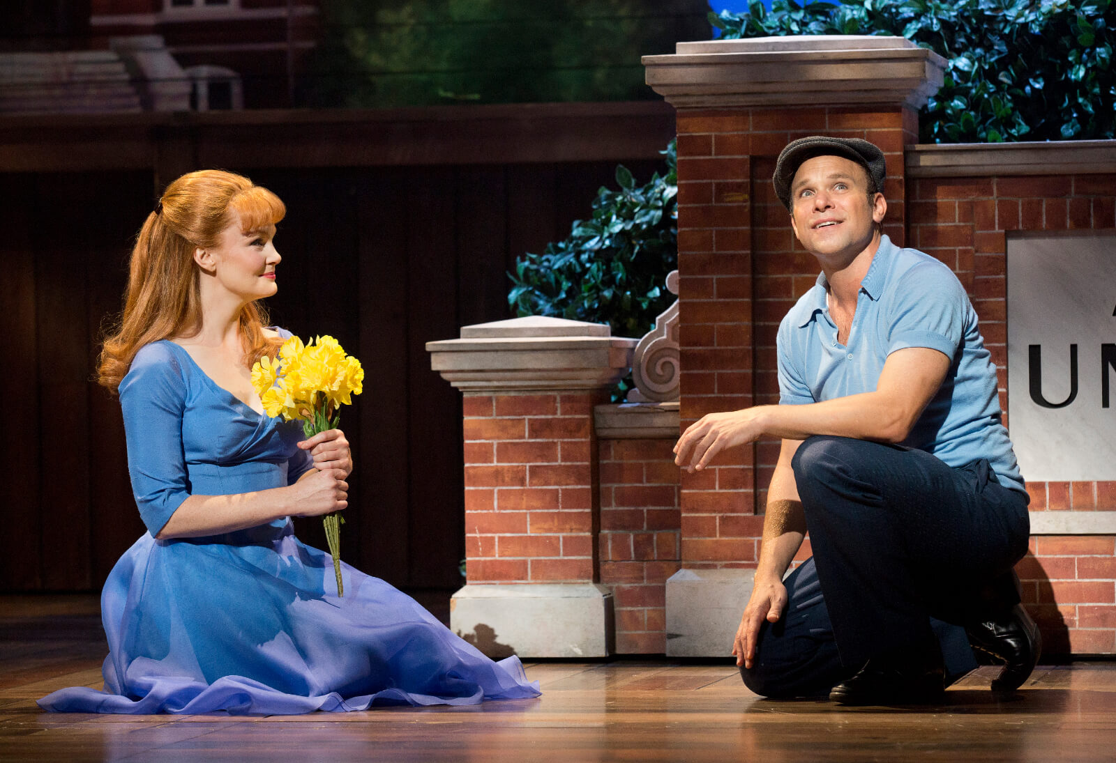 Sandra (Kate Baldwin) holds flowers as she and Edward Bloom (Norbert Leo Butz) share a moment.