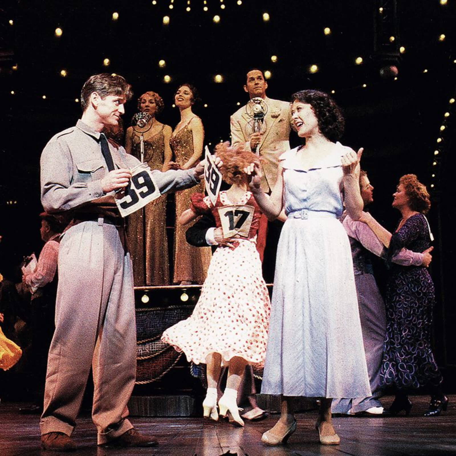 Bill Kelly (Daniel McDonald) ask Rita Racine (Karen Ziemba) to be his marathon dance partner. 