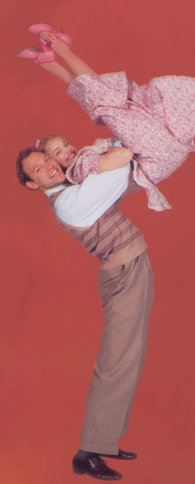 Happy McGuire (Jim Newman) dances with Precious McGuire (Kristin Chenoweth).