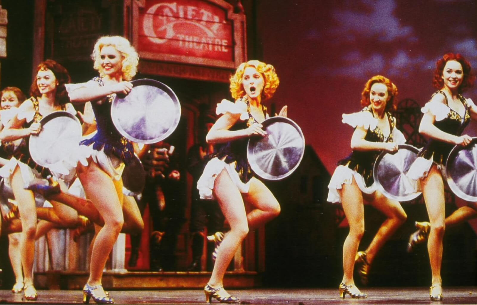 Ladies dancing with mining pans in West End’s Original company of Crazy for You. 