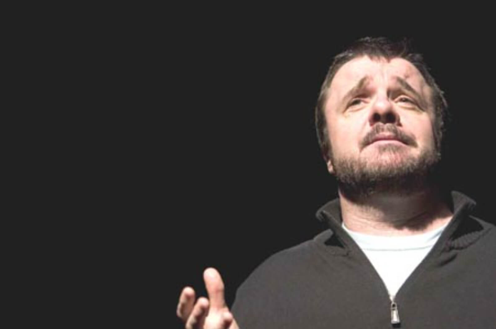 A close up Lou Nuncle (Nathan Lane) with an empathetic expression while performing in Dedication or the Stuff of Dreams