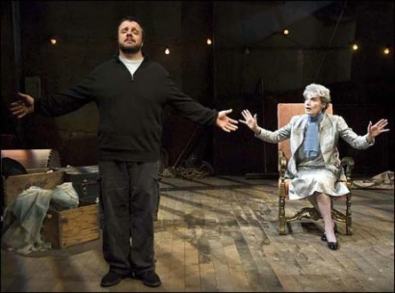 Lou Nuncle (Nathan Lane) stands with eyes closed and arms open while Annabelle Willard (Marian Seldes) sits behind him
