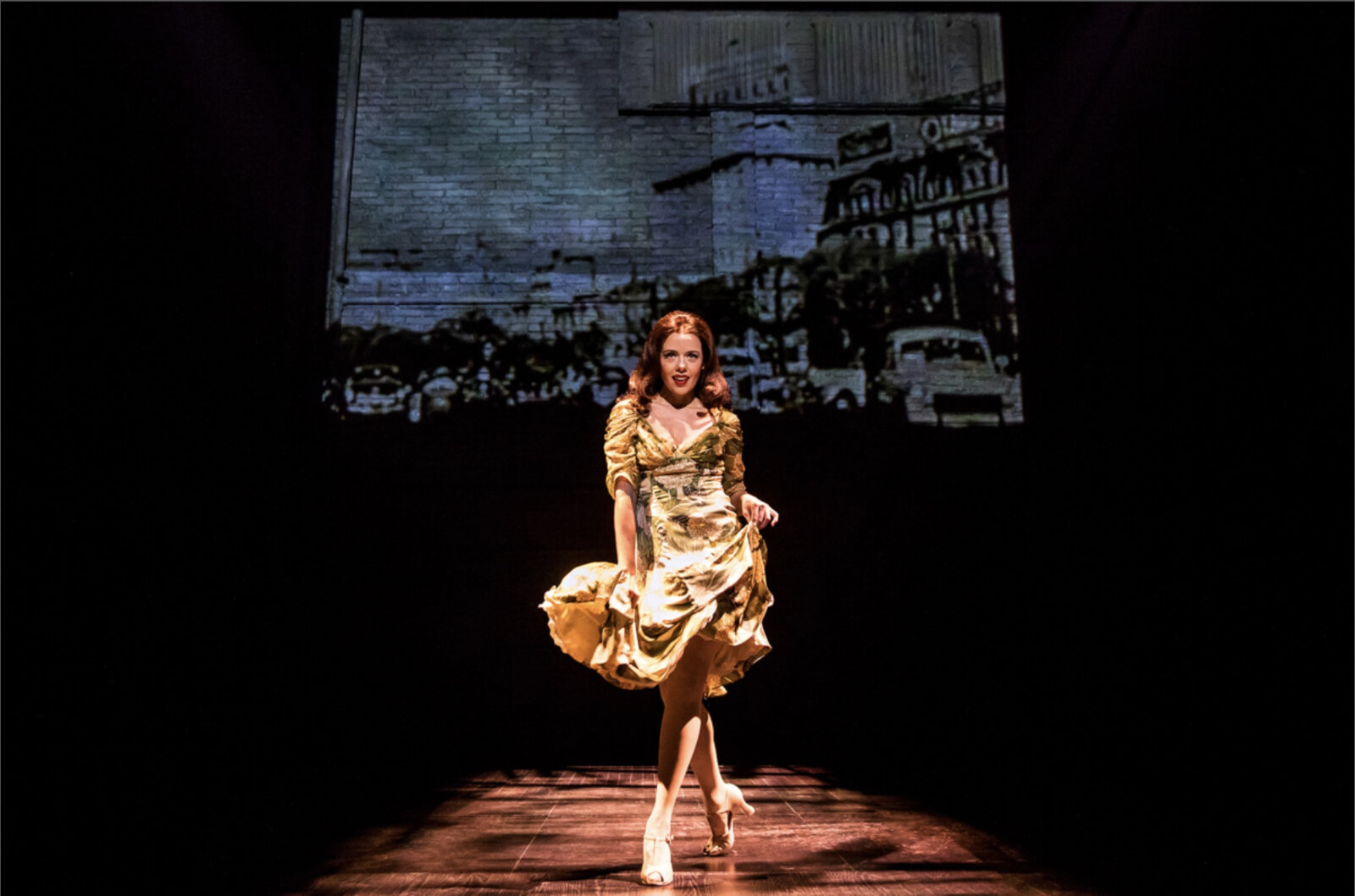 Janet Dacal performing "Buenos Airies" from Evita. She is singing and sashaying in a Gold dress in Prince of Broadway. 