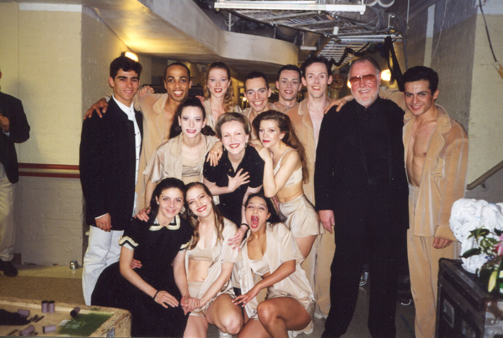 Susan Stroman and musical Director Paul Gemignani with the Martha Graham Dance Company. The dancers are backstage in costume and makeup.