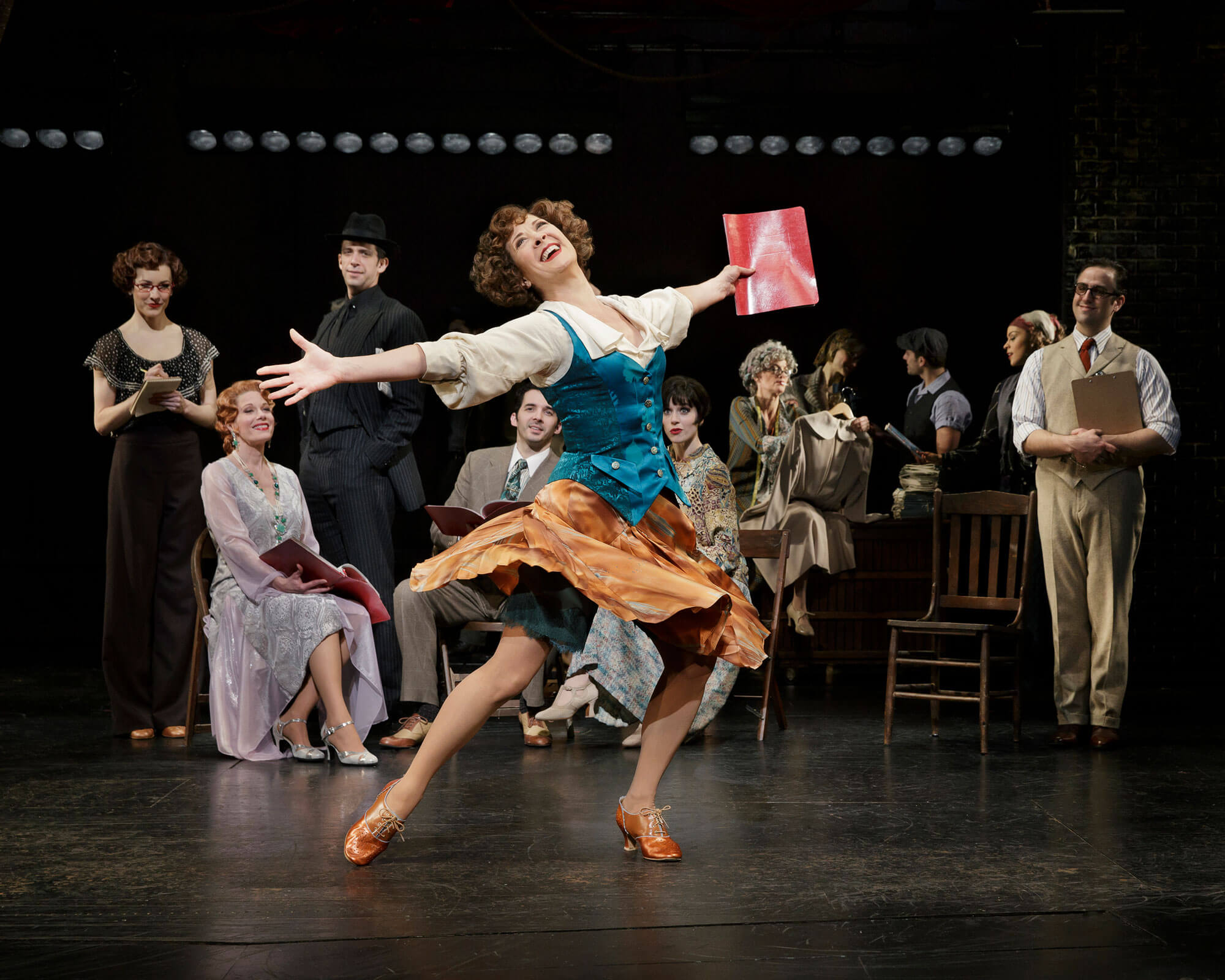 Eden (Karen Ziemba) joyfully sings "There's a New Day Comin'! with arms wide open and skirt twirling from a spin of joy!