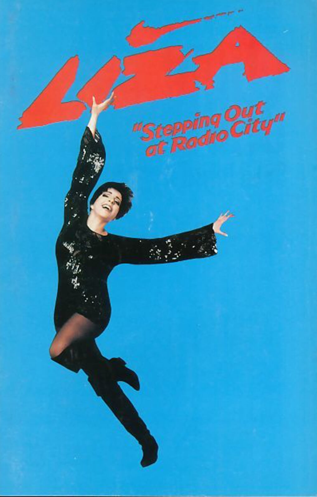 Logo image for Liza: Stepping Out at Radio City. Liza, dressed in a sparkly black dress, on a blue background with the title in red above her.