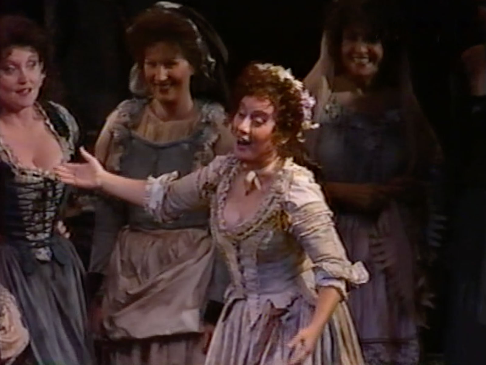 Erie Mills in the role of Zerlina. She is dressed as a peasant woman singing about her wedding to her girl friends in Don Giovanni.