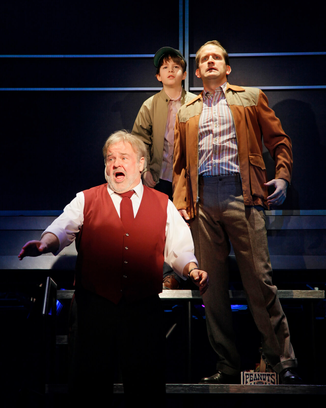 Kevin (Fred Applegate) singing "Best Seats in the Ball Park" with Young Kevin (Alexander Scheitinger) and Kevin's Father (James Moye).