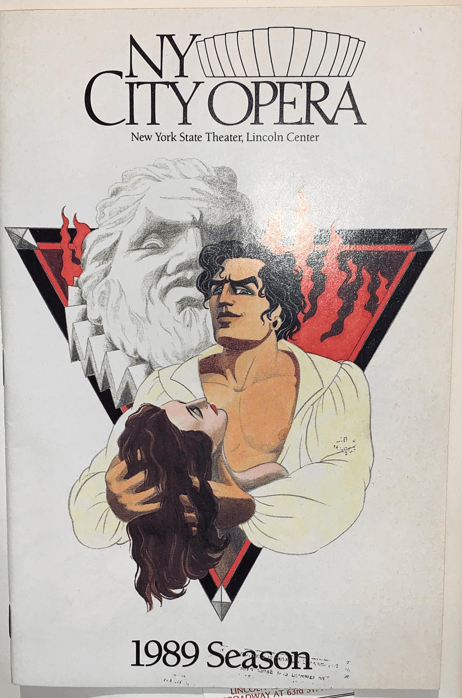 1989 season's Don Giovanni playbill cover art, with NY City Opera: New York State Theater, Lincoln Center written on the upper portion, and 1989 Season on the bottom. A colored photo of the main cast is at the center, with a grayscale sculpture within inverted triangle drawing behind them.