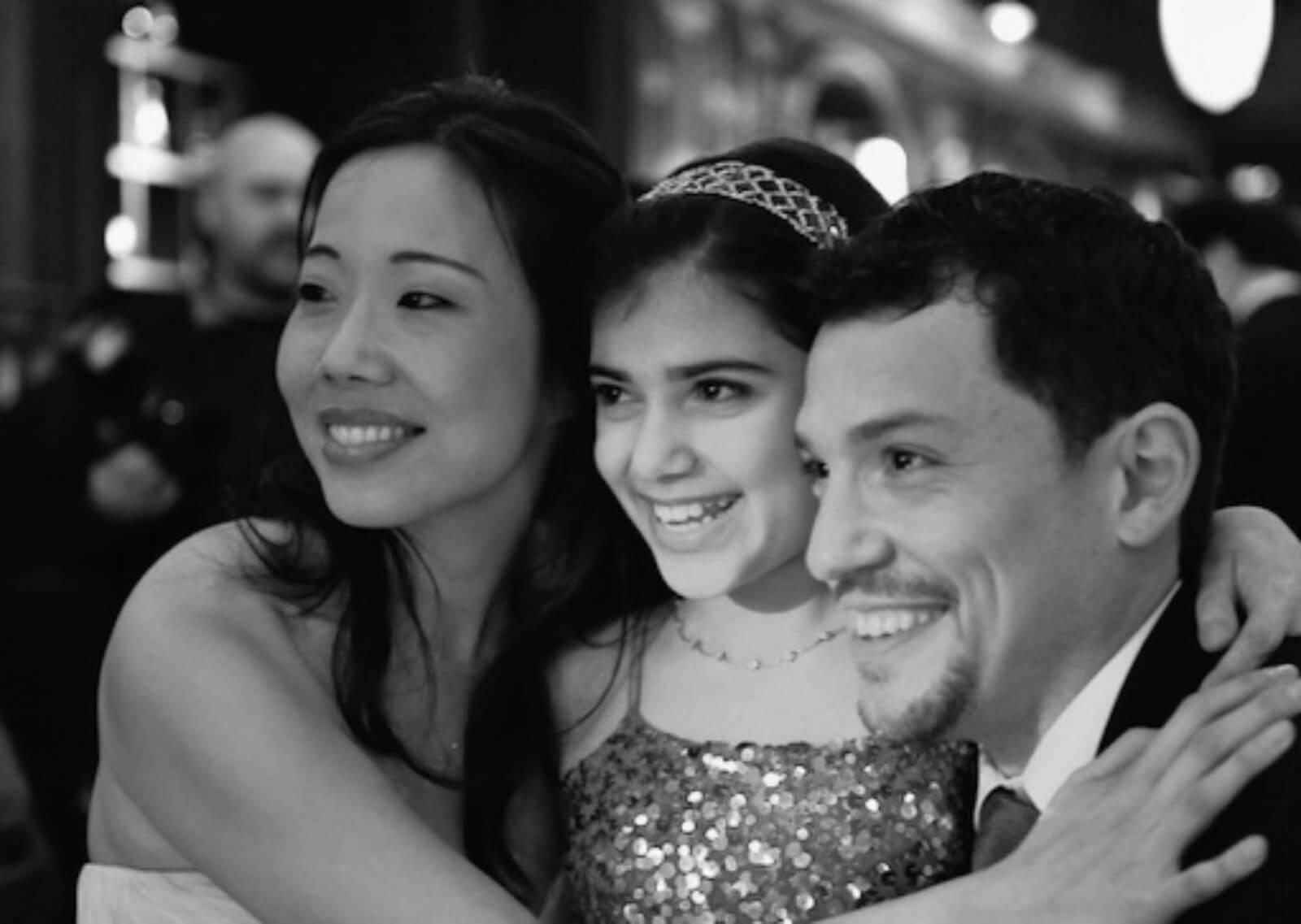 Black and white photo of members of the company in formal attire pictured from left to right: Pearl Sun, Lina Silver, Miguel Cervantes.