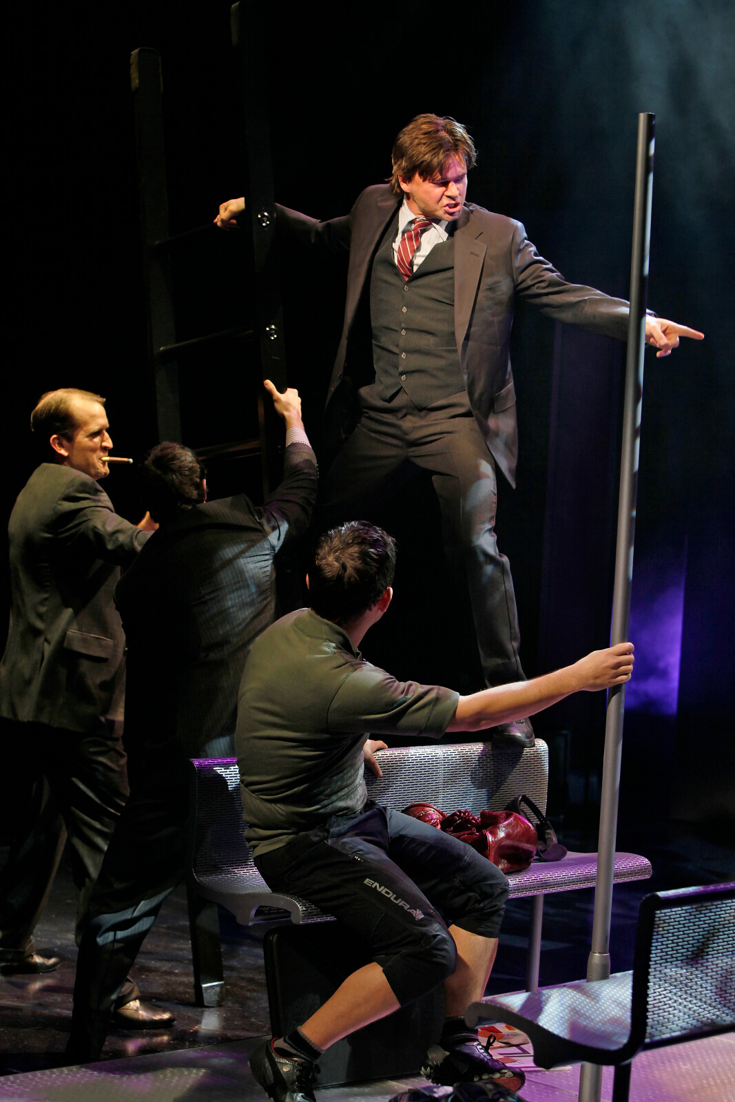 Stanley (Hunter Foster) sings "Step up the Ladder" to James Moye, Patrick Cummings and Miguel Cervantes.