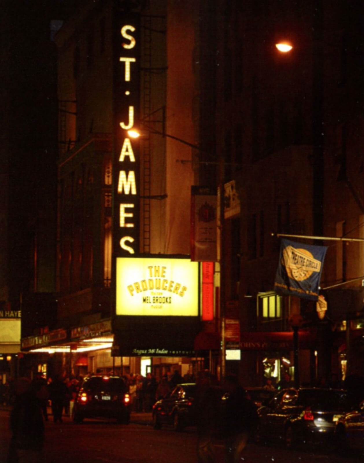The St. James Theatre at night, showing the marquee of The Producers.