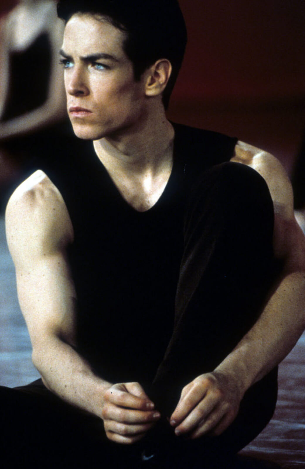 Sascha Radetsky (dressed all in black), tying his shoes.