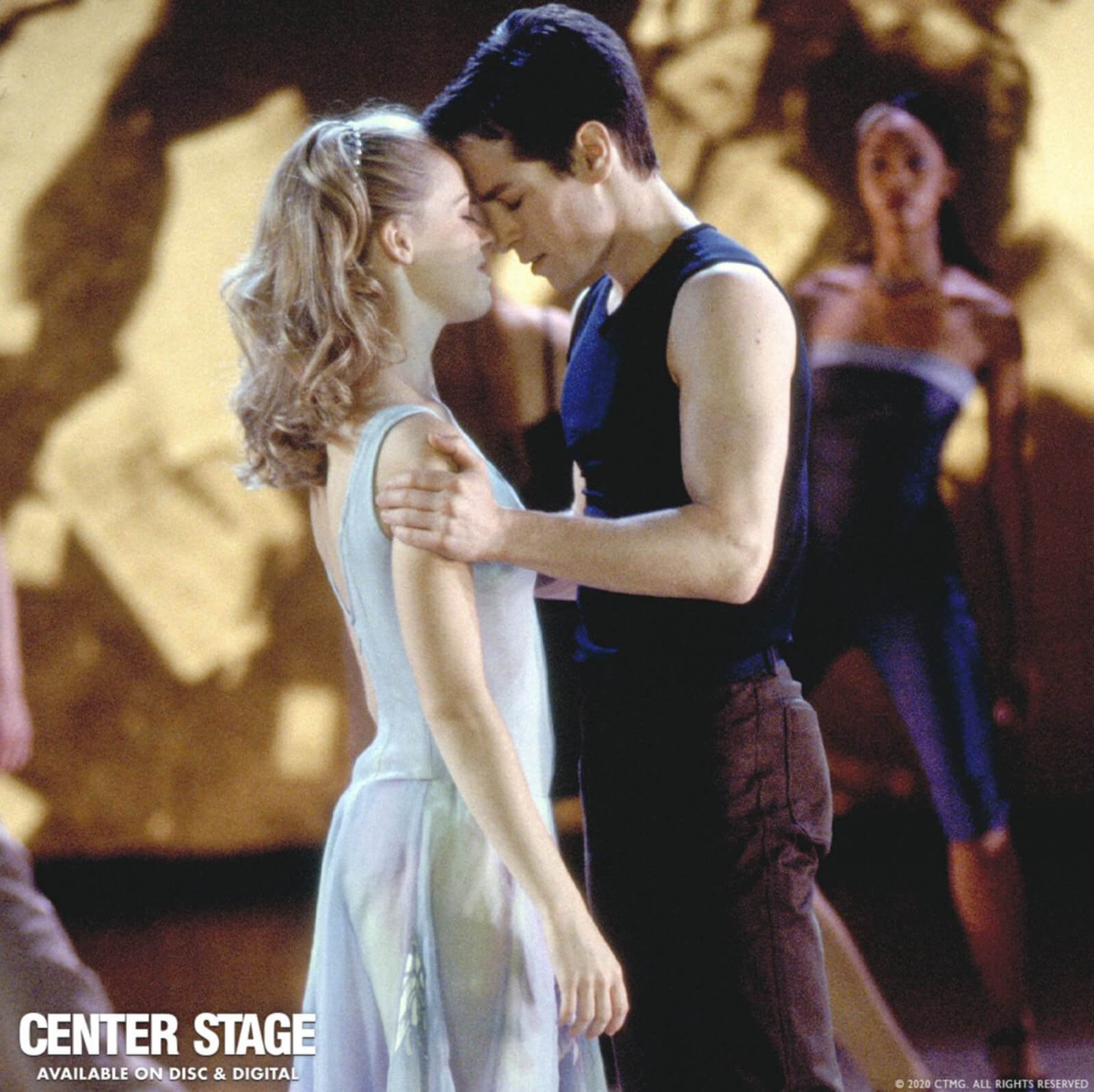Amanda Schull and Sascha Radetsky in a tender moment; foreheads touching and eyes closed dancing to “If I Was the One”.