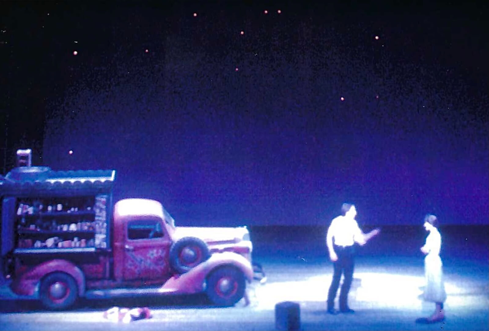 110 In the Shade at New York City Opera. Set by Michael Anania. Truck is onstage and Starbuck (Brian Sutherland) is talking to Lizzie (Karen Ziemba) under the stars.