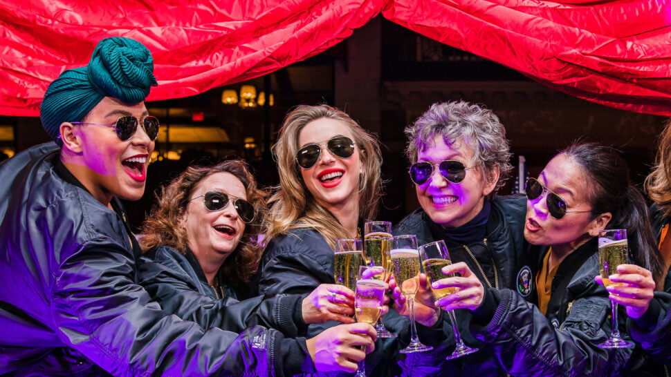 First preview with cast members (left to right) Lilli Cooper, Rachel Dratch, Julianne Hough, Julie White, and Suzy Nakamura. Women are wearing matching aviator sunglasses, bomber jackets, and clinking champagne flutes with a celebratory cheers.