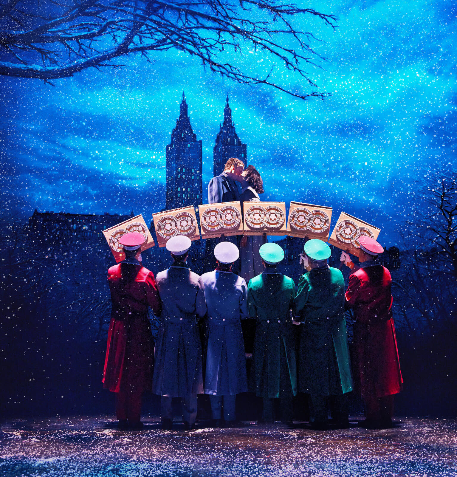 “New York in the Snow” with Anna Uzele and Colton Ryan. The lovers are kissing on a bridge (made by dancers and suitcase props) in Central Park with the skyline and snow is falling around them.
