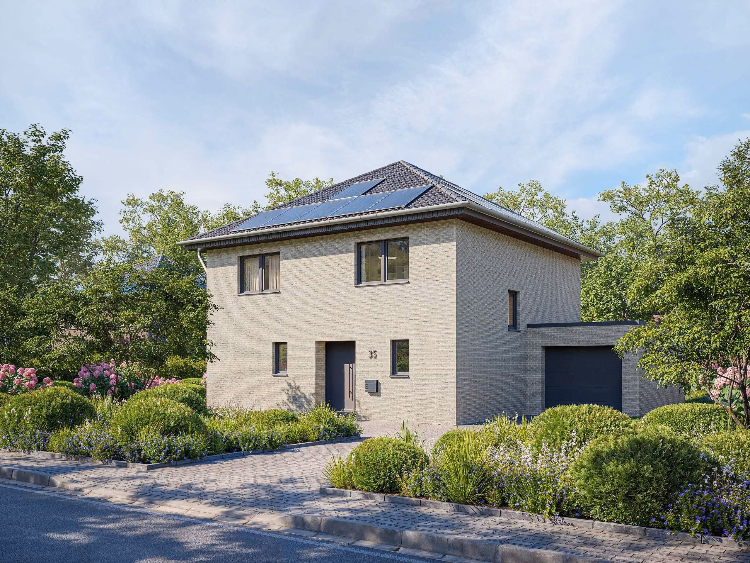 Modern house with beige brick facade, solar panels on the roof, surrounded by green bushes and flowers.