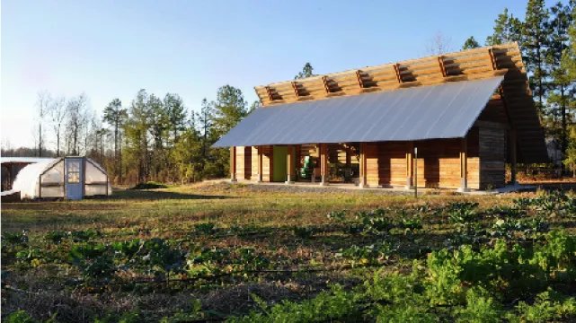 The workshop building and greenhouse at Benevolence Farm in Graham, North Carolina