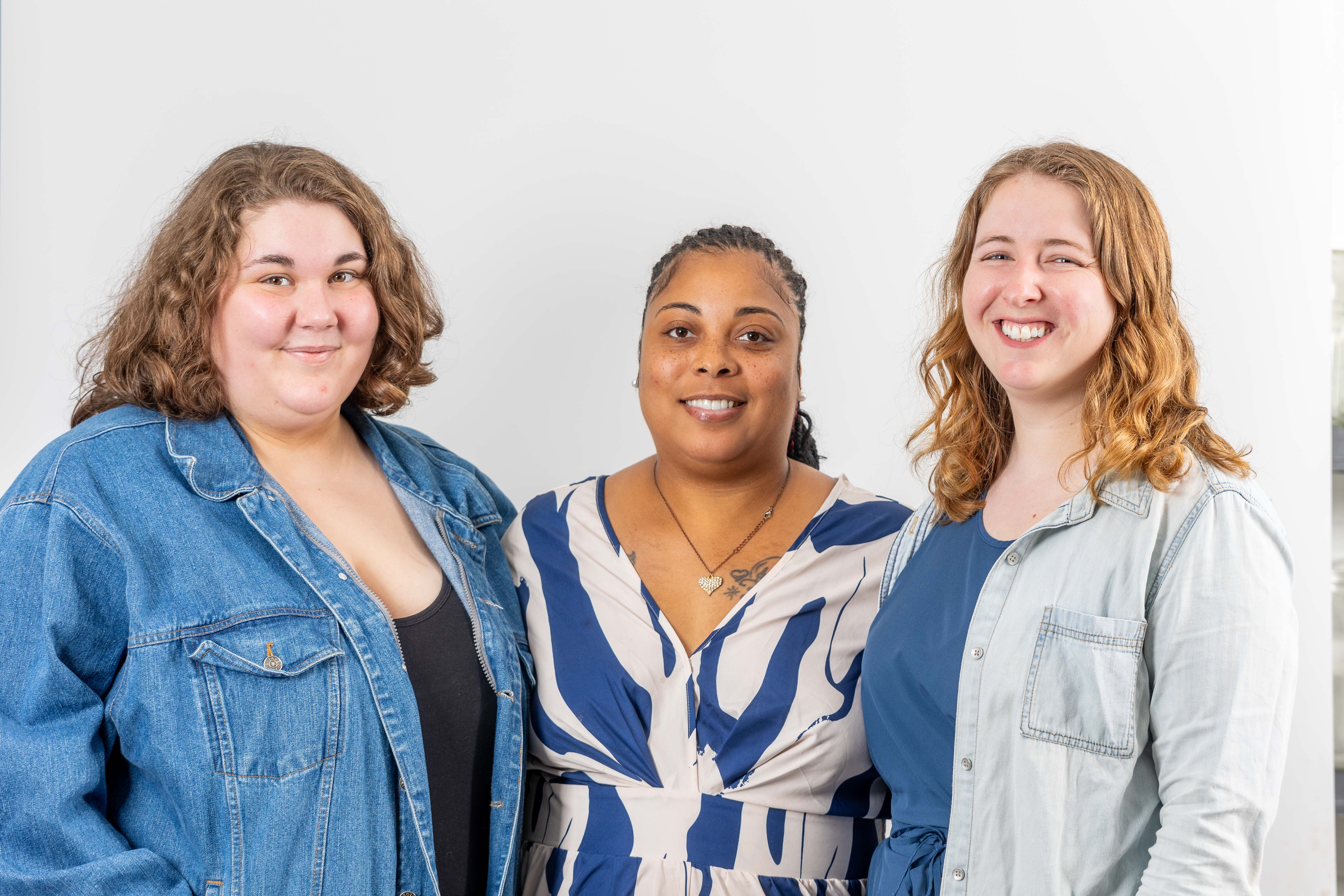 Three Benevolence Farm staff members standing together
