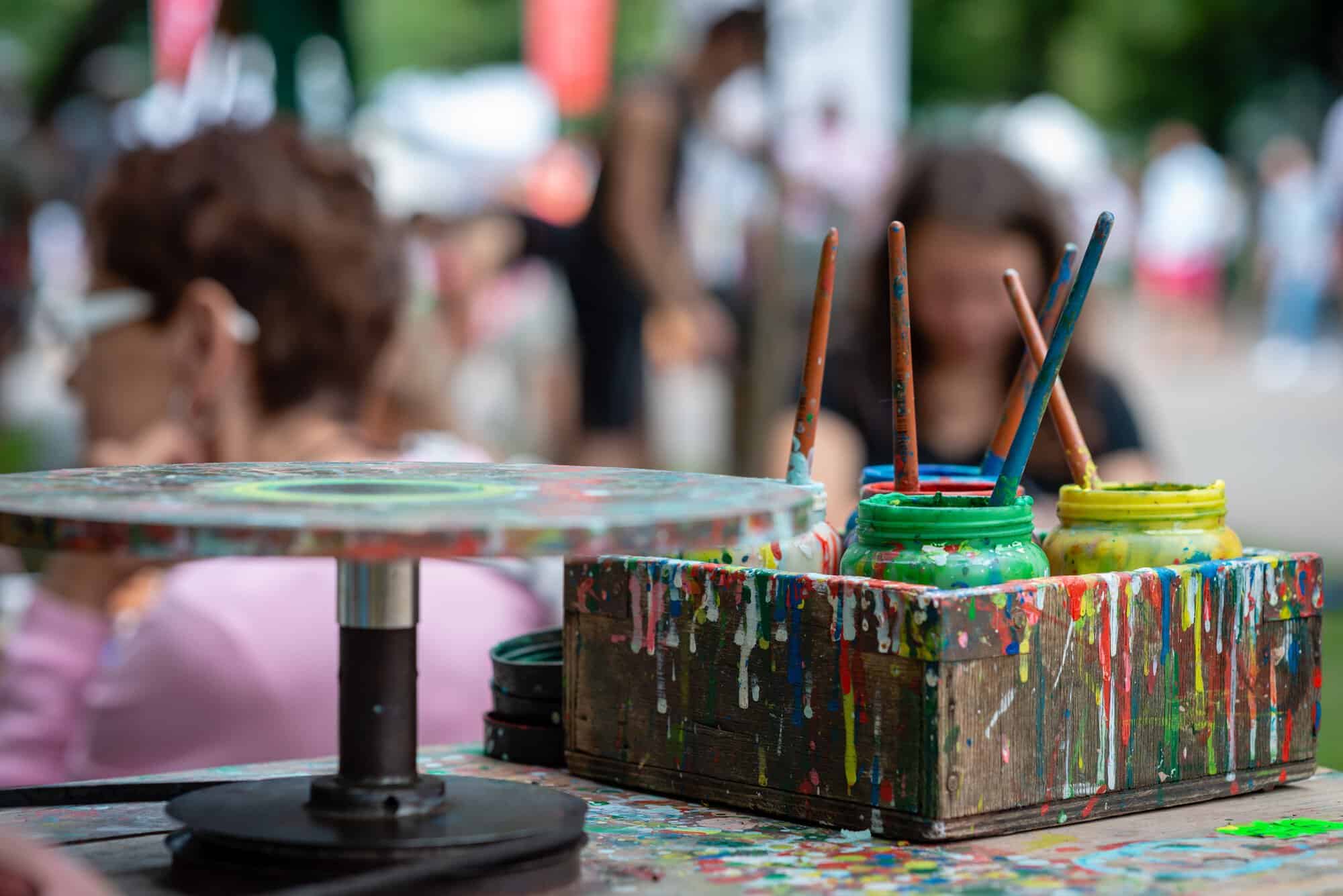 paint brushes in jars