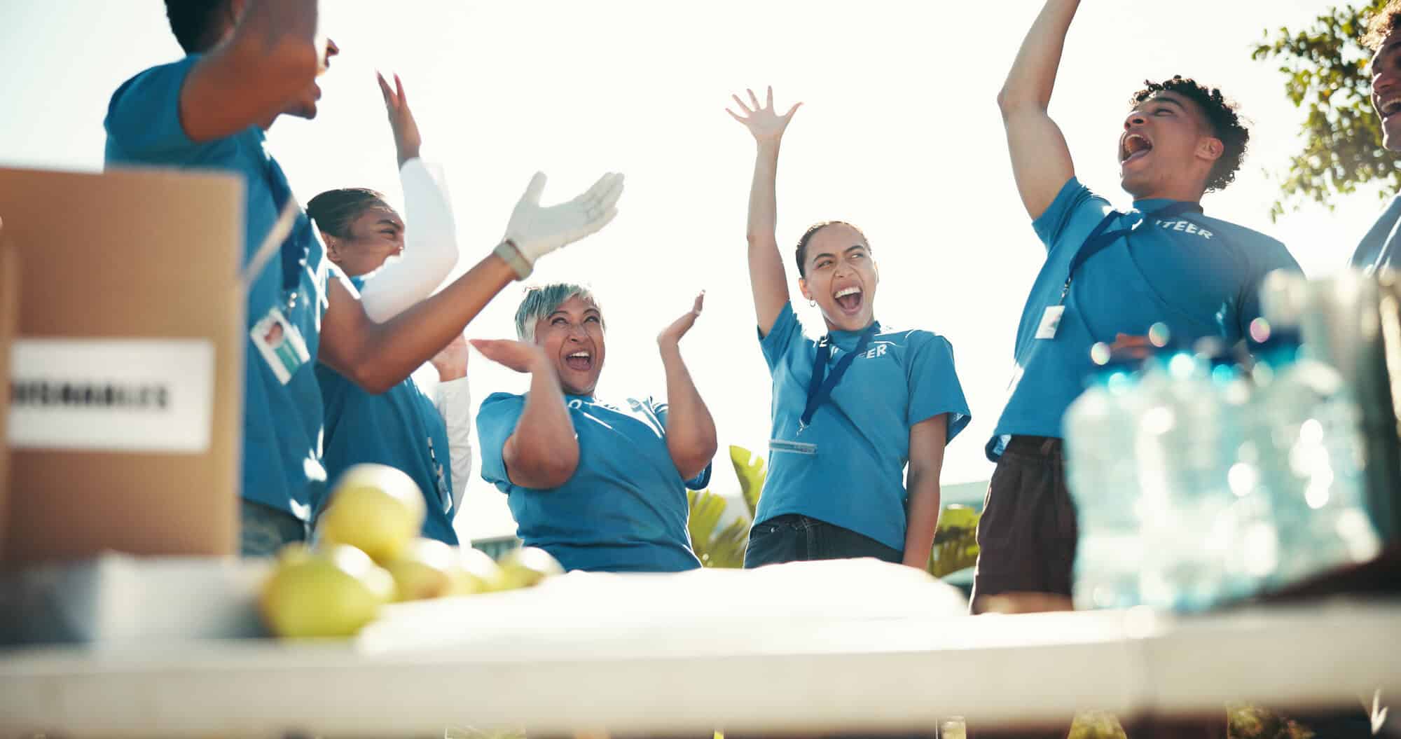 volunteers cheering in circle