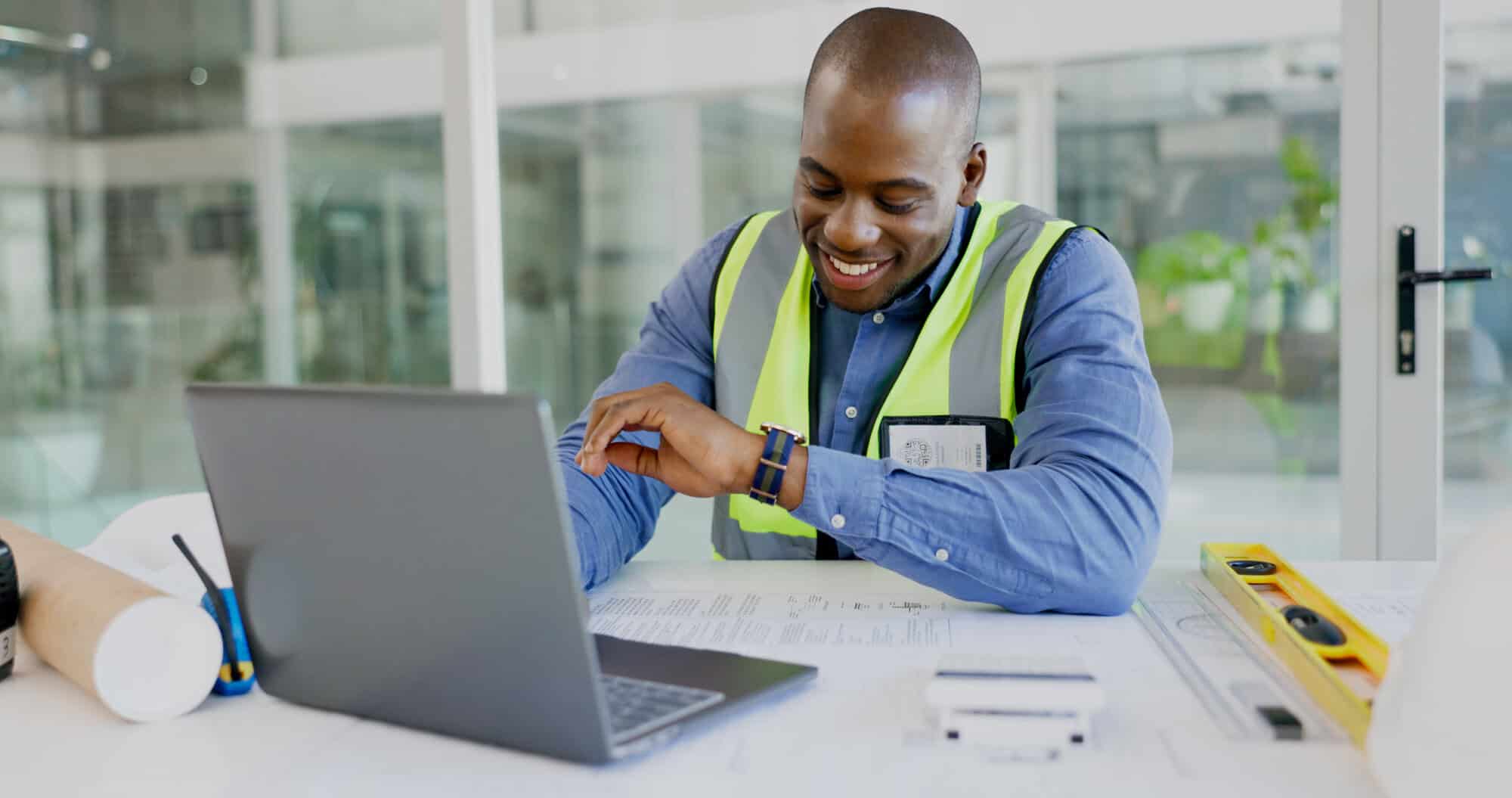 construction admin checking watch at desk