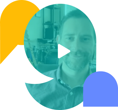 Play button overlaid on a man's smiling face with musical instruments in the background.