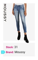 Person wearing light blue skinny jeans with frayed hems and black shoes on white background.