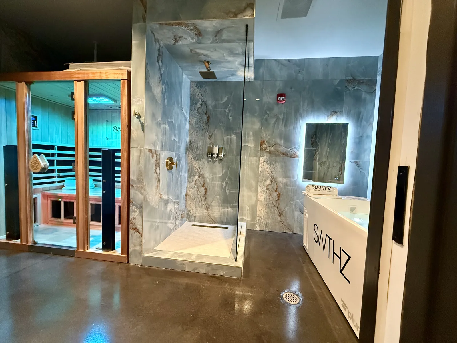 SWTHZ shower and sauna area with stained and sealed concrete floor and urethane topcoat