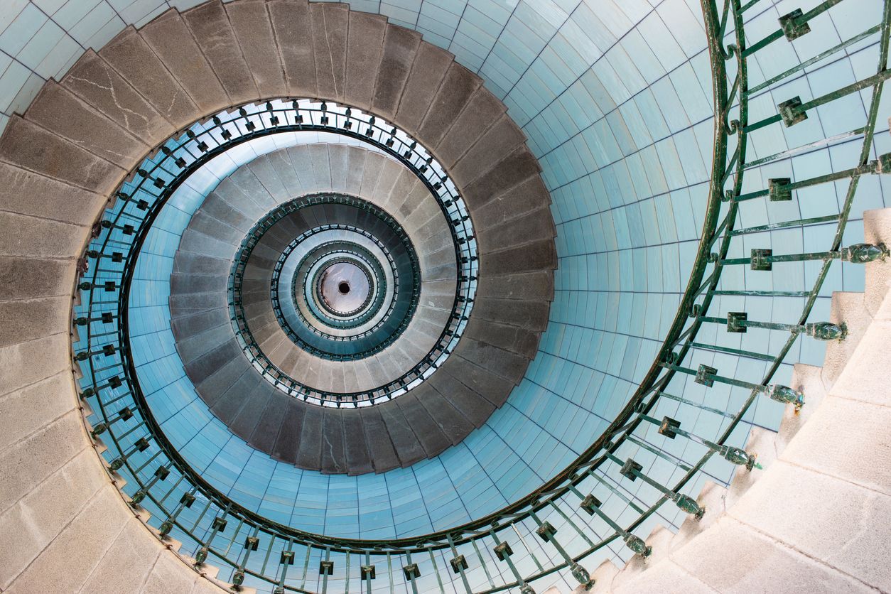 Looking up the spiral staircase inside a lighthouse