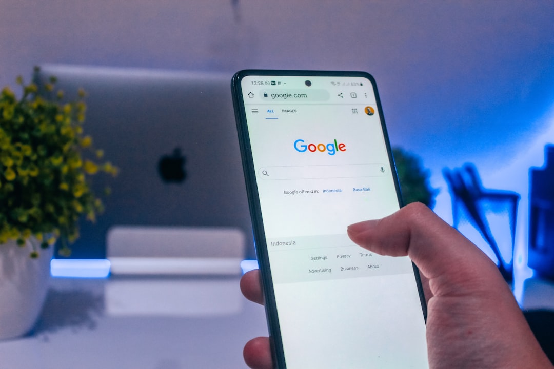 Person using a smartphone for mobile search demonstrating the dominance of mobile search in SEO strategy