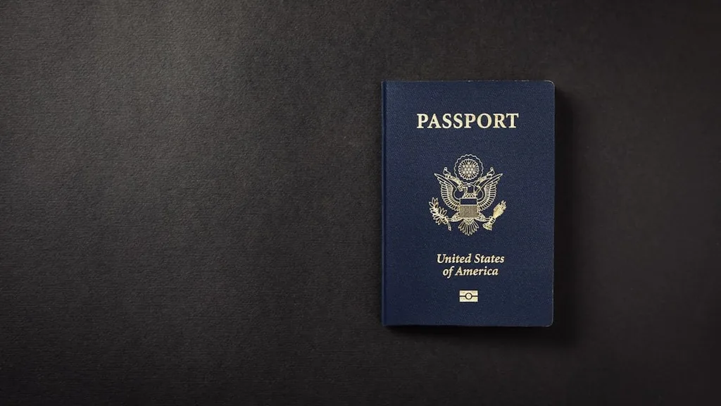 Passport and identity document beside a laptop, the ID required for a Meta Verified application