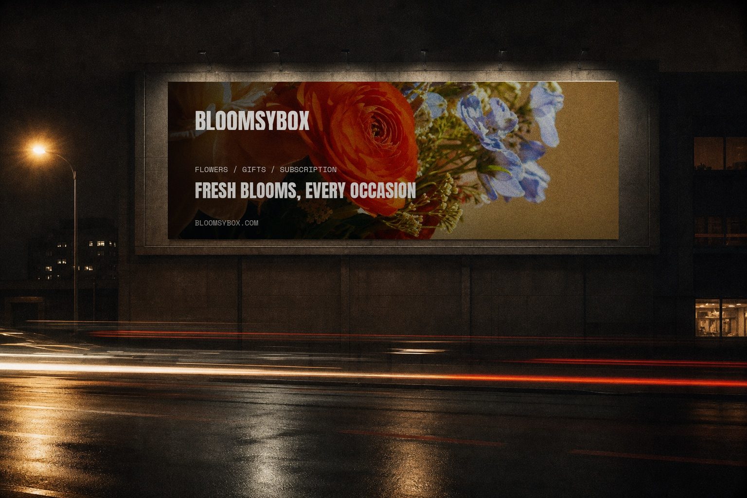 BloomsyBox campaign render — night billboard