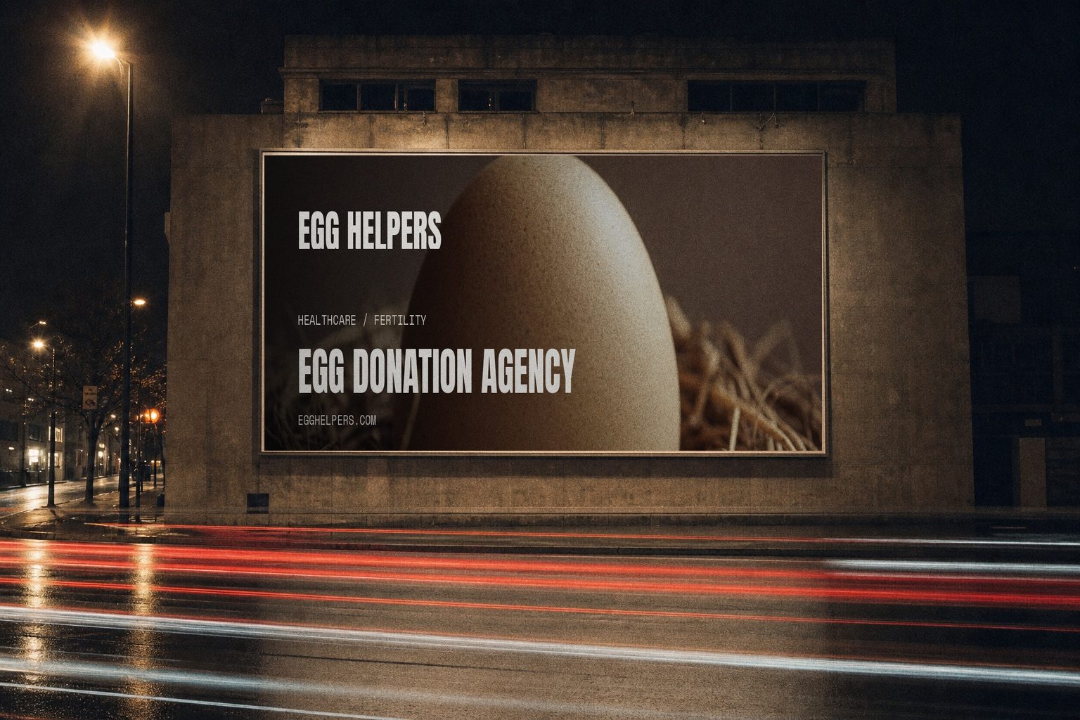 Egg Helpers campaign billboard lit at night