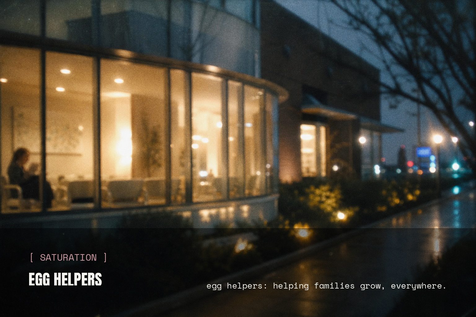 Egg Helpers brand mark in a blurred night street scene