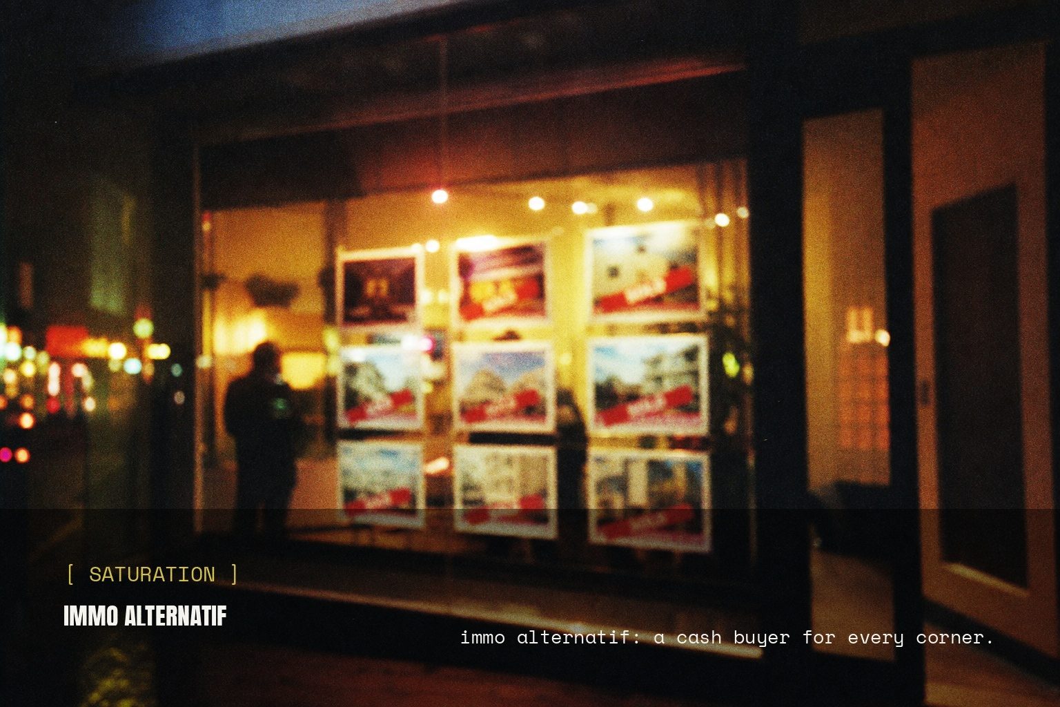 Immo Alternatif campaign artwork on a blurred night street