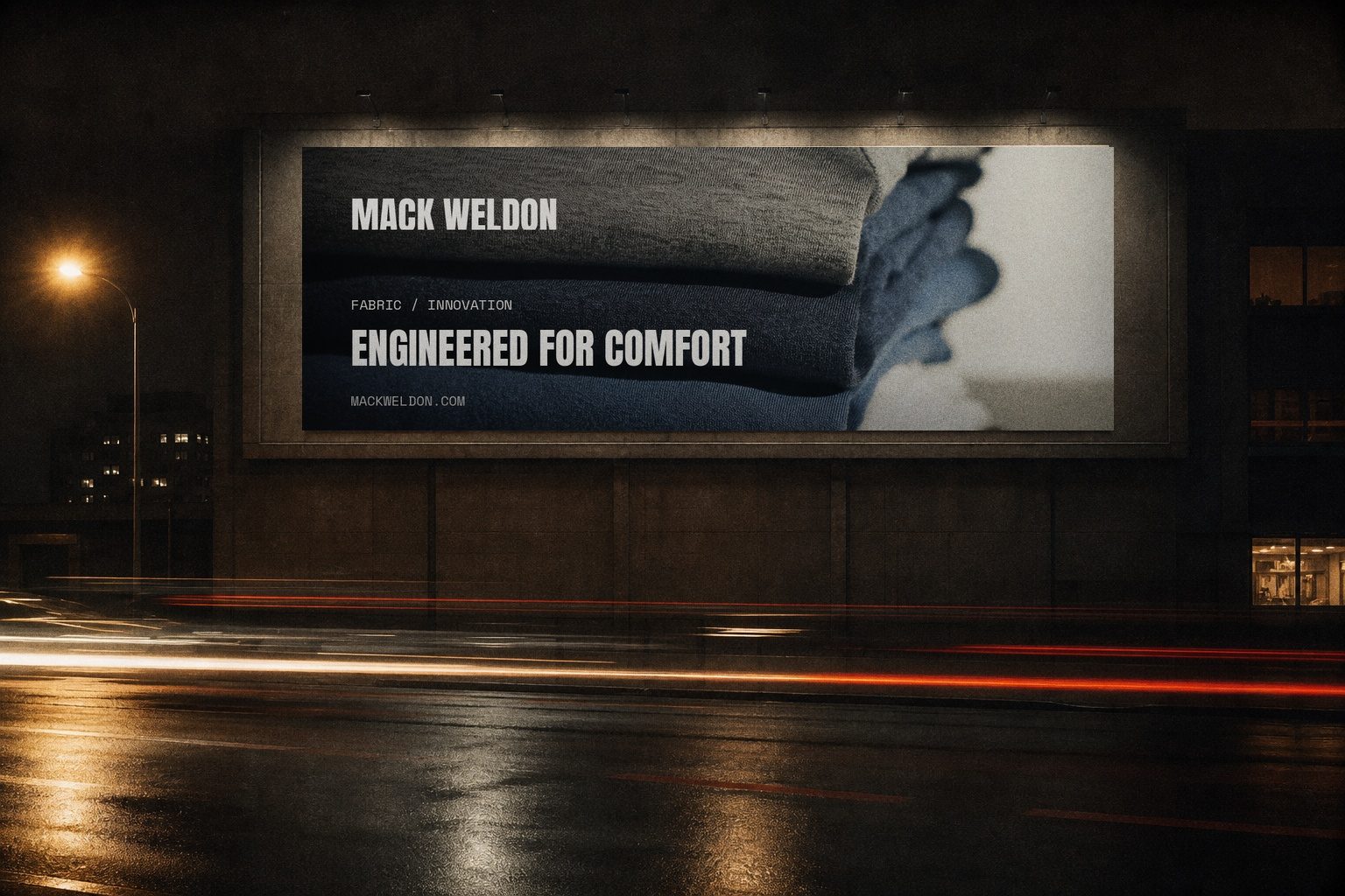 Mack Weldon billboard lit at night