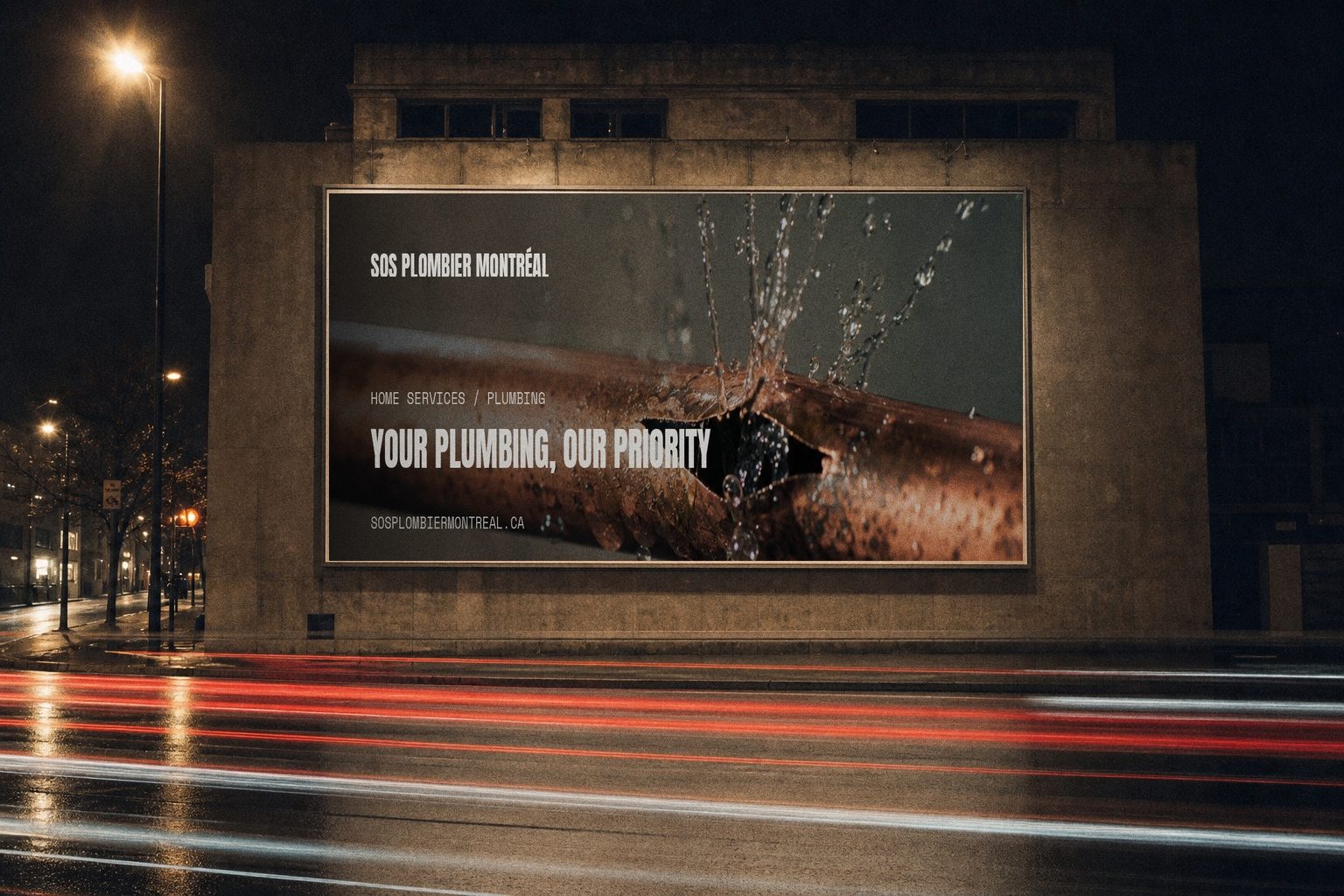 SOS Plombier campaign render — night billboard