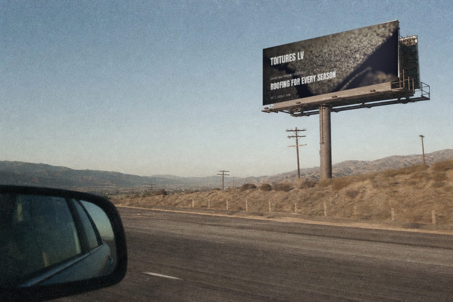 Toitures LV campaign render — highway billboard