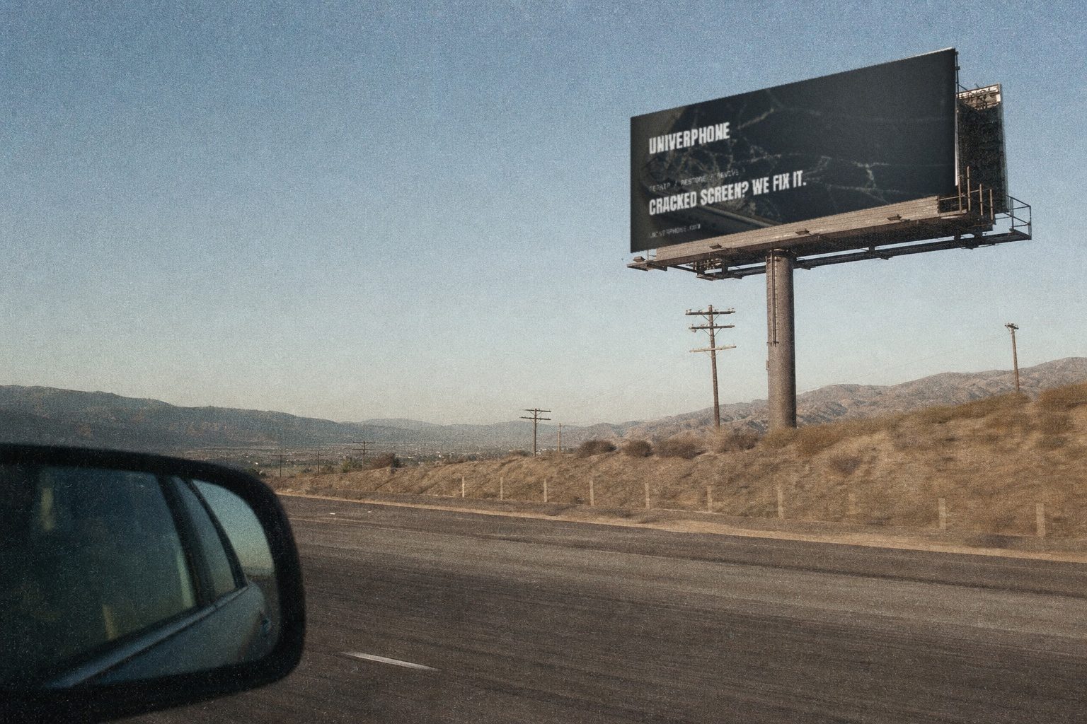 Univerphone highway billboard against the sky