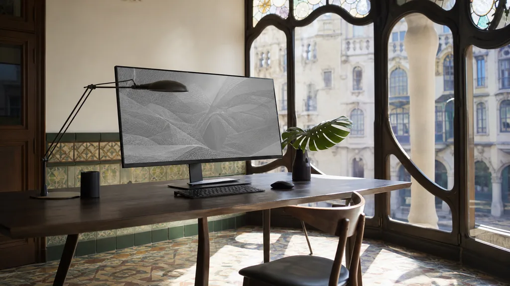 Editorial photograph of a Barcelona modernista design studio with hydraulic tile floor and bright Mediterranean light through arched windows
