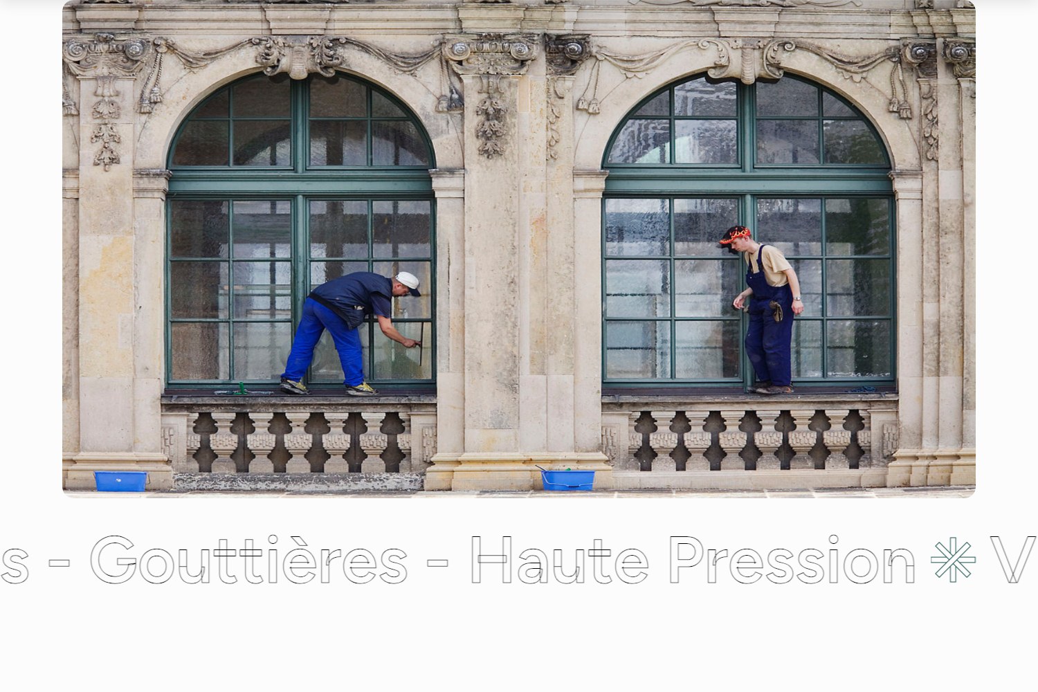 Full-bleed photograph of the crew washing arched windows on a stone facade