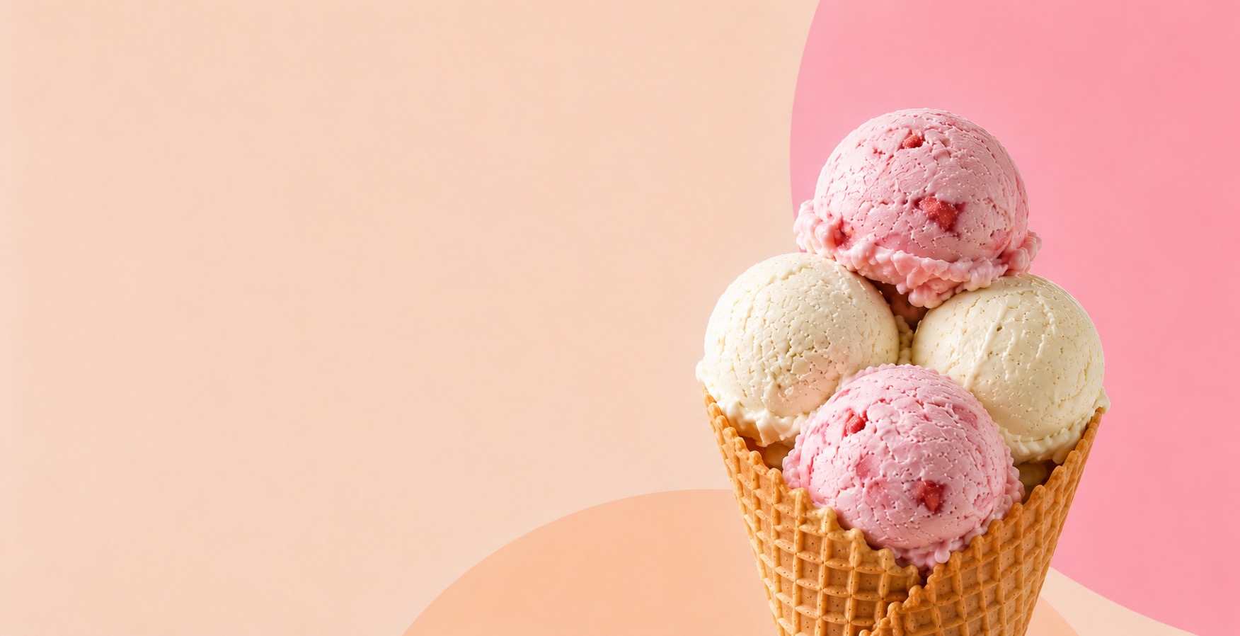 Waffle cone holding three scoops of ice cream, two pink and one vanilla-colored.