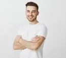 man in white t-shirt, hands crossed