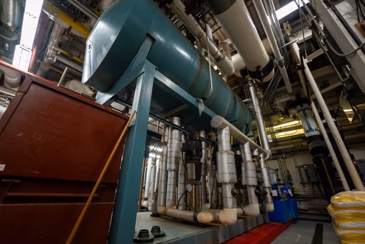 Mechanical room piping and heat exchangers installed by Mallory & Evans