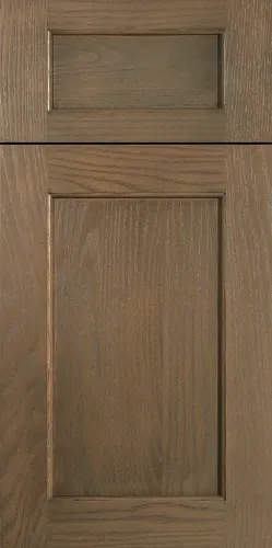 Wooden cabinet door with a raised panel and natural grain finish in a warm brown tone.