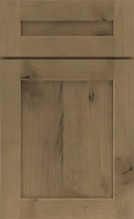 Light brown wooden shaker-style cabinet door with visible grain and knot details.