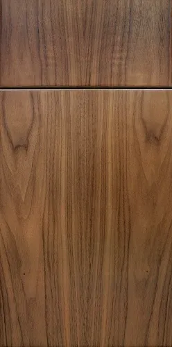 Close-up of polished wood cabinet doors with natural grain and warm brown tones.